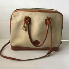 Dooney & Bourke Beige Brown Leather Large Handbag Adjustable Strap Two Inside Pockets Zipper Works Perfectly Approx Measurements 11”X16”X3.5” Strap Drop 18” Excellent Used Condition. Cream Satchel With Handle Drop For Travel, Large Handbag, Large Handbags, Dooney Bourke Handbags, Dooney & Bourke Bags, Beige Brown, Gold Leather, Brown Beige, Dooney Bourke