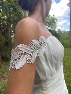 "READ BEFORE PLACING YOUR ORDER: - Buy samples of similar lace here: https://www.etsy.com/listing/190961642/sampleswatch-lace-chiffon-ribbon-or?ga_search_query=sample&ref=shop_items_search_1 - My stock is very limited and the order are made after they are placed. - THIS IS A CUSTOM ORDER I don't accept returns. - Read the reviews. You bought your dream dress but it doesn't have straps! No problem. I can made them for you. I'll try my best to match it as much as possible to your dress so they will look like part of the original design and you will feel happier with the result! Beautiful off the shoulder straps made of embroidered rayon ivory color lace. 3\" widest part. Length is 17\"  It will have one side of the snaps attach to both ends and the other side for you to attach to your dress Silver Fitted Bridal Accessories, Fitted Lace Bridal Belt For Ceremony, Fitted Lace Wedding Dress For Bride, Fitted Lace Work Wedding Dress For Bride, Fitted Lace Bridal Belt For Bride, Fitted Wedding Lace With Lace Back, Lace Bridal Accessories Fitted For Mother Of The Bride, Fitted Lace Bridal Accessories For Mother Of The Bride, Fitted Lace Back Dress For Weddings