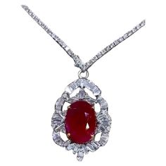 An exquisite pendant in classic design, so original and sophisticated style, a very impressive piece of art . Pendant come in 18K gold with a central natural Burma Ruby , fine quality, in perfect oval cut, magnificent red color , of 15,80 carats , treatment only heated, and 57 pieces of natural diamonds in baguettes and round brilliant cut of 2,57 carats, F color VS clarity, very bright. Piece of high jewelry. Handcrafted by artisan goldsmith. Excellent manufacture and quality of stones . Comple Art Pendant, Dream Jewelry, High Jewelry, Sophisticated Style, Diamond Pendant, Gold Pendant, Natural Diamonds, Jewelry Necklace Pendant, Ruby