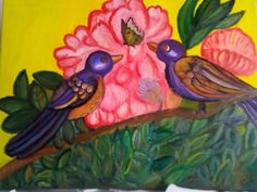 two birds are sitting on a branch with flowers