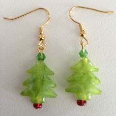 Beaded glass dangle earrings on goldtone fishhook wires.  Earrings hang approximately 1 1/2 inches. Holiday Gold Earrings With Ear Wire, Gold Earrings With Ear Wire For Holidays, Czech Glass Dangle Earrings With French Hook, Tree Earrings, Christmas Tree Earrings, Earring Tree, Pittsburgh Pa, Fish Hook, Pittsburgh