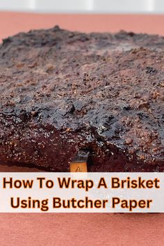 a brownie sitting on top of a table next to a sign that says how to wrap a brisket using butcher paper