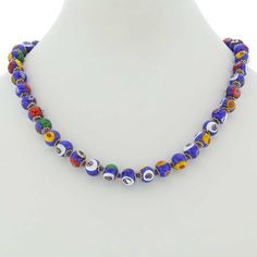 This beautiful Murano Glass Millefiori necklace offers classic Venetian style and effortless chic. Centuries-old Murano glass decorative technique perfected by Italian craftsmen is used to create colorful mosaic effect that is fun and trendy, yet classic and timeless. This necklace is a unique accessory that will add glamour and elegance to your look. Measurements: This necklace measures 15 to 16 inches in length and comes with an attractive velvet pouch and a certificate of authenticity. Becaus Traditional Blue Glass Necklaces, Multicolor Murano Glass Beaded Necklace, Blue Murano Glass Jewelry With Colorful Beads, Vintage Murano Glass Necklace For Gift, Multicolor Murano Glass Round Necklace, Unique Multicolor Murano Glass Necklaces, Colorful Mosaic, Elegant Blue Murano Glass Necklace, Murano Glass Necklaces