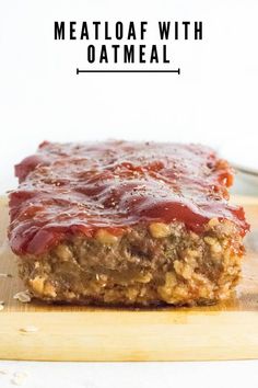 meatloaf with oatmeal is on a cutting board and has text overlay