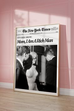 the new york times front page on display in a pink room