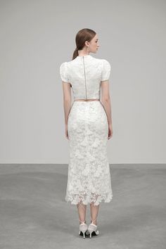 This timeless piece from this top is a must-have for any wardrobe. Flaunt your style with the cropped cut and Queen Anne neck, crafted from luxurious embroidered lace fabric. The perfect balance between graceful and modern, this top is ideal for formal and dressy occasions. Elegant Cropped Top With Delicate Lace, Chic Lace Top With Floral Embroidery, White Delicate Lace Cropped Top, Fitted Cropped Lace Top With Scalloped Edges, Fitted Cropped Lace Top With Scalloped Lace, Elegant Scalloped Lace Cropped Top, Elegant Cropped Lace Top, White Cropped Lace Top With Lace Trim, Fitted Chic Lace Crop Top