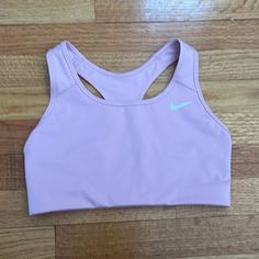 Nike Sports Bra In Size Medium. Medium Impact Non Padded Sports Bra. Color Is A Light Pink. Never Worn. Comes From A Smoke Free Home. Nike Pink Casual Sports Bra, Casual Pink Nike Sports Bra, Nike Sports Bra For Spring, Nike Sports Bra For Spring Sports, Nike Spring Sports Bra, Nike Sporty Sports Bra For Spring, Nike Casual Racerback Sports Bra, Casual Nike Racerback Sports Bra, Nike Casual Sports Bra For Training