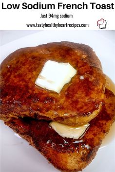 two pancakes with butter and syrup on them sitting on top of a white plate that says low sodium french toast