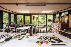 a room filled with lots of different types of art supplies on top of a table