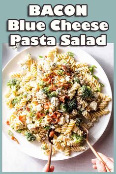 a white plate topped with pasta and broccoli