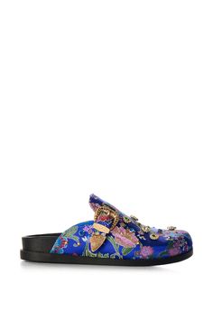 Glamorous, comfortable, chic. Meet The AZALEA WANG Quinby Brocade Clog in Blue. This floral satin brocade mule features a round toe silhouette, a flat rubber outsole, faux gold metallic hardware, and an easy slip-on fit. Complete with an assortment of ornate gemstone accents, a Western-inspired adjustable belted strap accent, and flat studded embellishments. (all measurements are approximate from size 7.5) - Brocade Textile Upper - Round Toe - Flat Sole - Imported Product ID: 386083 Comfortable Chic, Azalea Wang, Mule, Clogs, Gold Metal, Embellishments, Slip On, Size 7, Satin