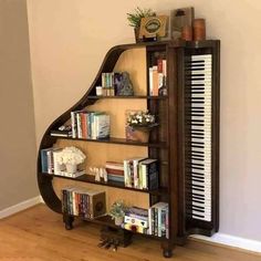 a piano shelf with many books on it