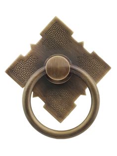 an antique brass door knock with a round handle and square design on the outside of it