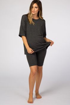 A sleep set featuring a dolman short sleeve top with a front pocket and a pair of biker shorts. The Charcoal Biker Short Maternity Sleep Set is perfectly bump-friendly! Relaxed Fit Short Set With Short Sleeves For Lounging, Relaxed Fit Short Set For Lounging, Comfortable Short Sleeve Activewear For Loungewear, Black Short Sleeve Tops For Lounging, Black Short Sleeve Activewear For Loungewear, Black Short Sleeve Sleep Top, Maternity Sleepwear, Sleep Set, Pregnancy Stages