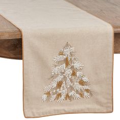 a table runner with a christmas tree on it