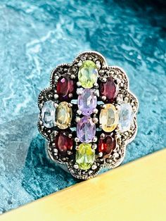 Sterling Silver Vintage Oval Multi-Gemstone & Marcasite Ladies Cocktail Ring ring size 6  12.g mm-L27 x 21W Multicolor Cabochon Rings In Fine Jewelry Style, Multicolor Cabochon Rings Fine Jewelry, Fine Jewelry Multicolor Oval Gemstones, Oval Multicolor Gemstones For Anniversary, Multicolor Oval Gemstones For Anniversary, Oval Multicolor Multi-stone Rings, Multicolor Oval Multi-stone Cluster Ring, Multicolor Gemstone Cluster Ring, Vintage Oval Cabochon Gemstones