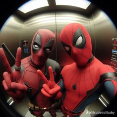 two people dressed as deadpool and spider - man are making the peace sign in front of a mirror