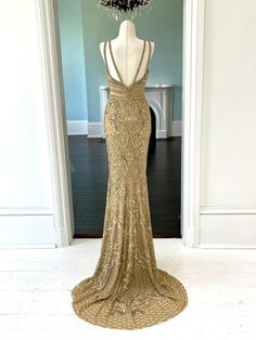 Transform into a regal #beauty in our C44307 gown. The stunning sleeveless design features intricate #gold beading, a flattering v-neckline, and an elegant empire waistline. Perfect for #pageants and #special occasions, this #dress will make you feel like a true queen. Get this Sleeveless gold beaded #pageant gown with v-neck and empire waist line created as shown or with ANY changes. Our #design firm can also make inspired recreations of any of the #pageantdresses you #love on the internet for Gold Luxury Gown With Fitted Bodice, Gold V-neck Evening Dress With Sweep Train, Luxury Gold Evening Dress With Fitted Bodice, Luxury Gold Gown For Prom Season, Luxury V-neck Gown For Prom Season, Luxury Gold Dress With Sweep Train, Gold Gown With Fitted Bodice For Pageant, Luxury Gold Evening Dress For Prom, Elegant Pageant Dress With Fitted Bodice