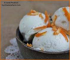 three scoops of orange zest ice cream in a bowl