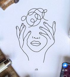 a drawing of a woman's face with her hands on her head, surrounded by other objects