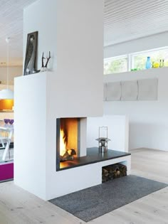 a white room with a fireplace in it