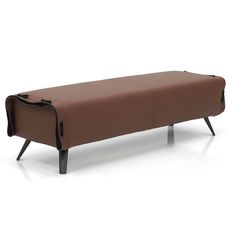 a brown bench sitting on top of a white floor