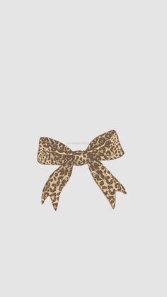 an animal print bow on a white background