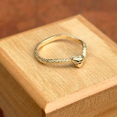 14KT yellow gold snake wave band ring with diamond eyes. Size 7 May be doable in other sizes Weight: 2.22 grams Band width: 2.1mm Solid 14k gold (2) diamonds; 1 on each eye Genuine diamonds 14k Gold Snake Shape Ring For Anniversary, 14k Gold Snake Ring For Anniversary, Yellow Gold Snake-shaped 14k Gold Rings, Gold Snake-shaped Diamond Ring For Anniversary, Adjustable Yellow Gold Snake-shaped Ring, Fine Jewelry Yellow Gold Snake Ring For Promise, Adjustable 14k Gold Snake Ring For Anniversary, Stamped 14k Gold Snake Ring For Anniversary, Adjustable Snake Ring In Yellow Gold