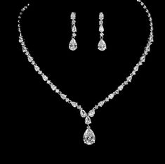 BEST SELLER Every piece is made to perfection, we only use the finest CZ diamond like cubic zirconia for that dazzling and dramatic look and always at a fraction of the price of any bridal boutique. NEW another great seller, classic glamour, simple yet very elegant perfect for any special occasion.High end designer cubic zirconia . One of our best selling necklaces, tradition and elegance never goes out of style. 1 1/2" earrings, pierced 14k white gold electroplated**BRACELET SOLD SEPARATELY** a Dazzling Teardrop Bridal Necklace In Cubic Zirconia, Wedding Diamond Teardrop Necklace With Sparkling Stones, Teardrop Cubic Zirconia Bridal Necklace With Brilliant Cut, Wedding Diamond Necklace With Teardrop Sparkling Stones, Dazzling Teardrop Cubic Zirconia Bridal Necklace, Elegant Rhinestone Drop Necklace For Wedding, Teardrop Crystal Bridal Necklace With Elegant Design, Teardrop Bridal Necklace With Brilliant Cut Cubic Zirconia, Teardrop Bridal Necklace With Sparkling Cubic Zirconia