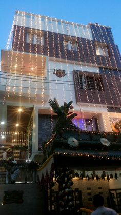 a building with christmas lights and decorations on it