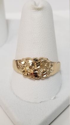 "Thanks for shopping our vintage estate store. We tend to sell well below wholesale and truly hope you enjoy all of our items. Many of the items are one of a kind, so please enjoy scrolling through the pictures and hopefully something will catch your eye. Black spots are from camera or reflections. Nice estate 10k yellow gold nugget ring. Nice vintage ring. Ring size: 10.25 can be sized up/down $25 Setting: 3/8\" Band width: 2.5mm 1/8\" Weight: 1.51 grams Sweet ring, marked 10k and is real gold. Daughter Band, Gold Nugget Ring, Beach Rings, Sweet Ring, Ring Stack, Gold Nugget, Dad Son, Band Engagement Ring, Engagement Bands