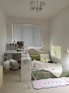 a bedroom with a bed and desk in it