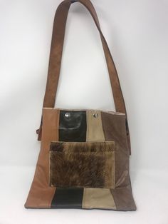 "Purchased in California at a swap meet, repurposed handmade bag used one time! strap is 1 1/4\"wide/strap drop 11\"/height 12\"/Length 11\"/smoke free environment/top closure two snaps(45)" Handmade Retro Brown Shoulder Bag, Retro Brown Handmade Shoulder Bag, Retro Patchwork Shoulder Bag For Everyday Use, Vintage Patchwork Shoulder Bag For Travel, Retro Style Patchwork Shoulder Bag For Everyday Use, Brown Upcycled Shoulder Bag For Daily Use, Vintage Brown Patchwork Shoulder Bag, Daily Use Brown Upcycled Shoulder Bag, Brown Upcycled Crossbody Shoulder Bag