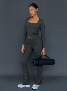 Stretchy and comfortable, the Integrity Activewear Yoga Pants feel as good as they look  Featuring a high-waisted design & a flared leg  Sized for a comfortable fit. If you prefer a more supportive feel we suggest sizing down  This item was created with reclaimed nylon, a high quality material that's designed to be long lasting and lower impact  Perfect for mix n' matching (we suggest the Thriving Activewear Top Grey)  80% reclaimed polyester 20% spandex  Care guide: Cold gentle machine wash Grey Yoga Pants, Baby Crop Top, Yoga Outfit, Pink Formal Dresses, Yoga Activewear, Strapless Tops, Winter Tops, Workout Outfit, Loungewear Sets