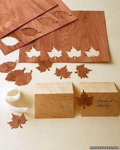 wooden stamps with maple leaves on them next to some other woodworking tools and supplies