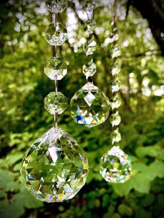 three crystal hanging drops in the woods