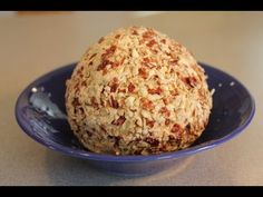 a blue bowl filled with oatmeal on top of a table