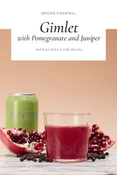 a glass of pomegranate next to a can of juice