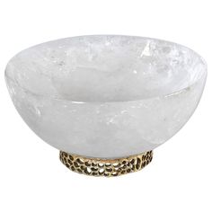 a white bowl with gold accents on the rim