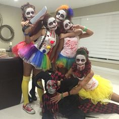 a group of people in costumes posing for a photo