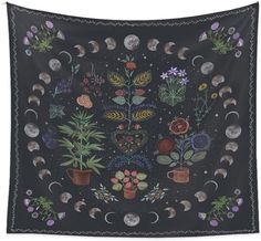 a tapestry with plants and moon phases on it