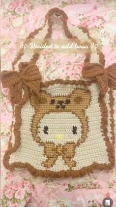 a crocheted bag with a teddy bear on it