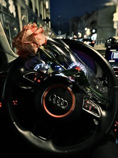 the interior of an audi car with flowers on the dashboard