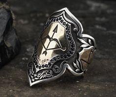 "Arrow Archer Thumb Zihgir Ring for Men, Sterling Silver Archery Ring, Arrow ring, Arabic ring, Historical Ring, Warrior Ring, Royal Ring What is Zihgir? \"Zihgir\" means archery ring. The shooting ring used in the bow thumb pull technique is the name given to the ring-shaped ring that archers wear on the thumbs of their right hands, used to prevent the finger from getting hurt while pulling the bow. *General Description* -All Kuyumcuzade products are made of 925 sterling silver. -All Kuyumcuzad Historical Rings, Desired Features, Royal Ring, Warrior Ring, Royal Rings, Cool Rings For Men, Armor Ring, Arrow Ring, Magical Jewelry