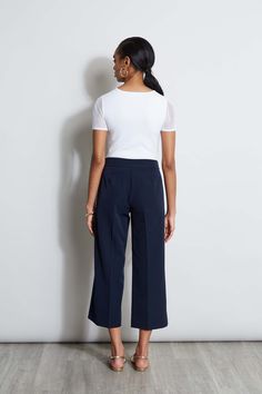 Springs "IT" pant is a chic update to the relaxed wide leg pant. We're obsessed with its cropped length, higher waist silhouette with graphic D-ring belt. Wear it with a knit or layered with a blazer, it will become a favorite in your wardrobe. T-Tahari Crepe Wide Leg Cropped Pant with D-Ring Belt Detail Runs true to Size Model is 5'9" and wearing size 2 Dry Clean Only Imported Style #: THF44003 High-waisted Workwear Culottes With Elastic Waistband, High-waisted Culottes With Elastic Waistband For Work, Chic Cropped Wide Leg Pants With Elastic Waistband, Workwear Culottes With Elastic Waistband And Cropped Leg, Workwear Culottes With Elastic Waistband, Chic Cropped Leg Dress Pants For Office, Cropped Leg Culottes With Elastic Waistband For Work, Chic Cropped Leg Dress Pants For Business Casual, Chic Wide Leg Culottes For Business Casual