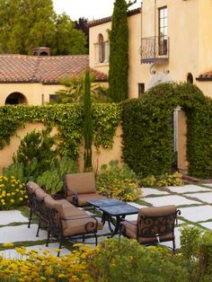 an outdoor seating area with chairs and tables