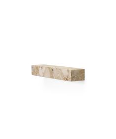 a white marble shelf sitting on top of a wall