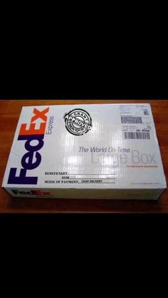 fedex box sitting on top of a wooden table