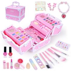 an open pink suitcase filled with makeup and nail polishing supplies on a white background