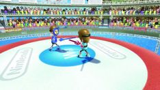 two cartoon characters are playing on an ice rink in front of a large group of people